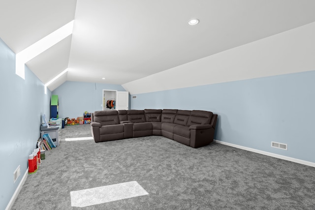 carpeted living room featuring lofted ceiling