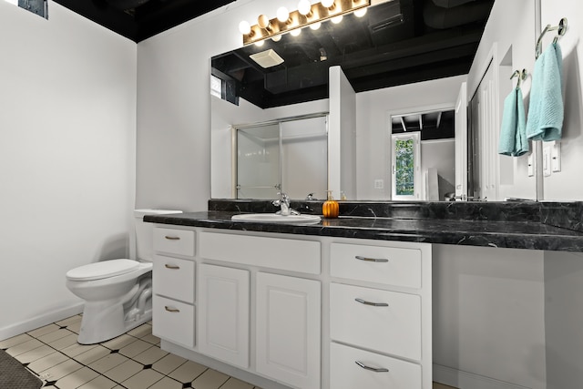 bathroom featuring tile patterned floors, vanity, an enclosed shower, and toilet