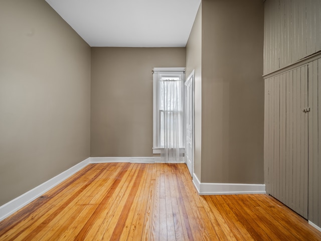 spare room with hardwood / wood-style flooring