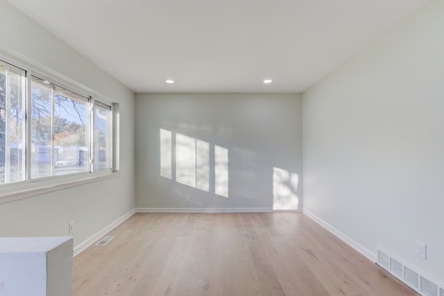 unfurnished room with light hardwood / wood-style floors