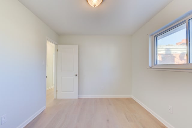 unfurnished room featuring light hardwood / wood-style flooring