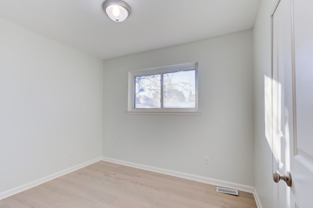 unfurnished room with light hardwood / wood-style floors