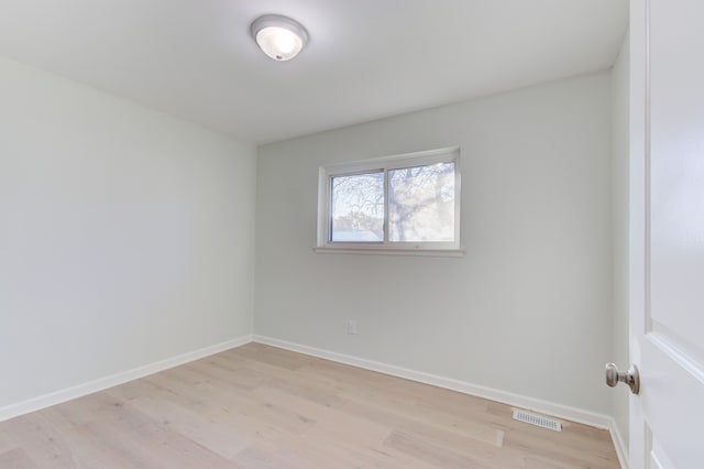 empty room with light hardwood / wood-style floors