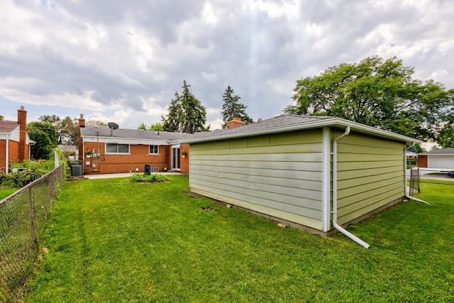 back of house with a yard, a patio, and central AC unit