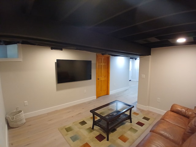 unfurnished living room featuring baseboards and light wood-style floors