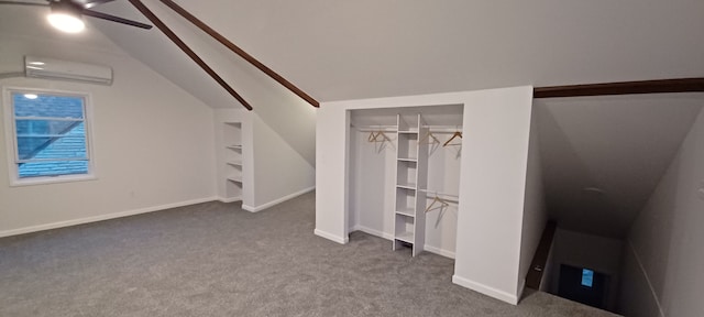 interior space featuring ceiling fan, lofted ceiling, carpet floors, and a wall unit AC