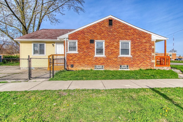 bungalow-style home featuring a front yard