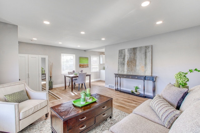 living room with light hardwood / wood-style floors