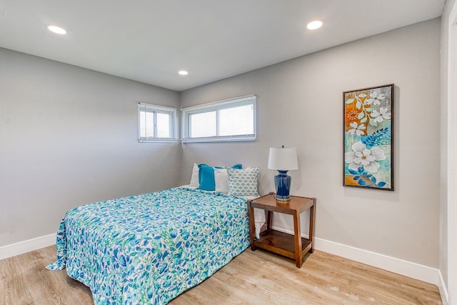 bedroom with wood-type flooring