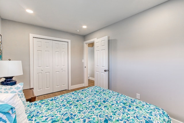 bedroom with hardwood / wood-style flooring and a closet