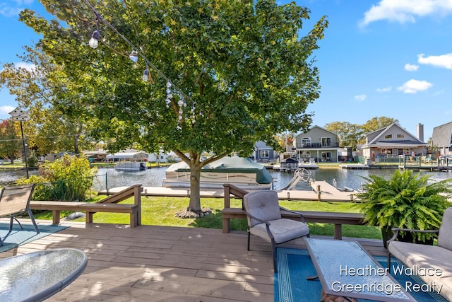 view of patio with a deck with water view