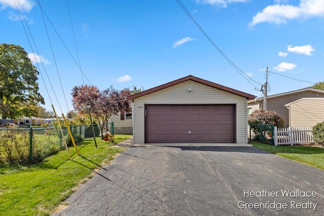 garage featuring a yard