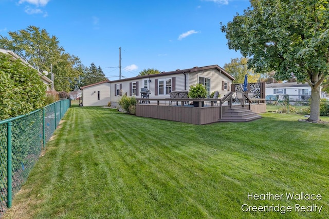 view of yard featuring a wooden deck