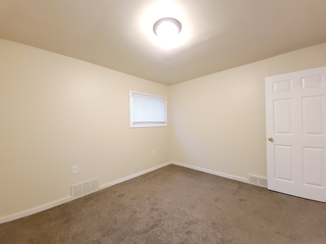 unfurnished room with carpet flooring