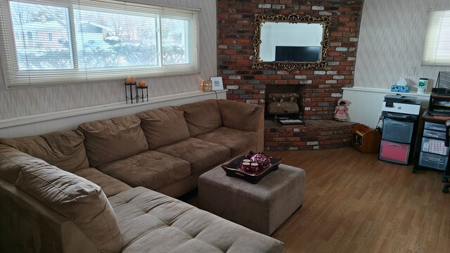 3624 Evergreen Pkwy, Flint, MI 48503 - living room with a fireplace and light hardwood / wood-style floors