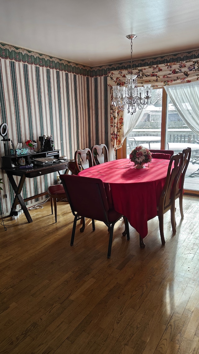 3624 Evergreen Pkwy, Flint, MI 48503 - dining area with hardwood / wood-style floors and a notable chandelier