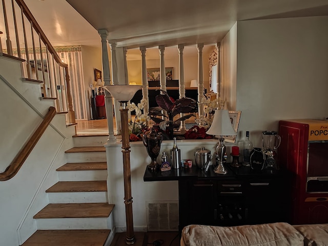 3624 Evergreen Pkwy, Flint, MI 48503 - staircase featuring decorative columns