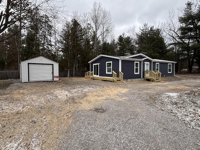 view of front of house with an outbuilding and a garage