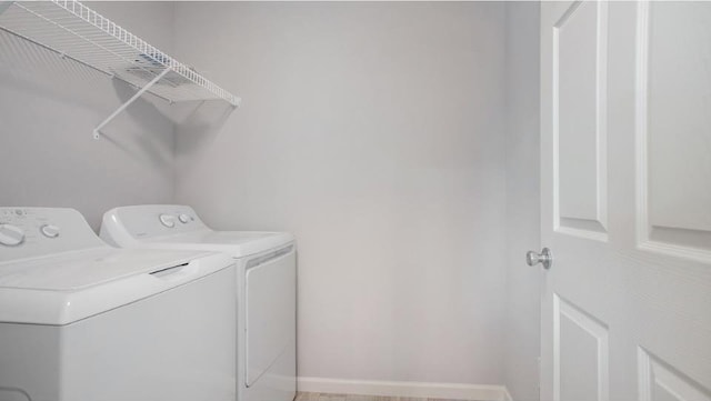 laundry room with washer and clothes dryer