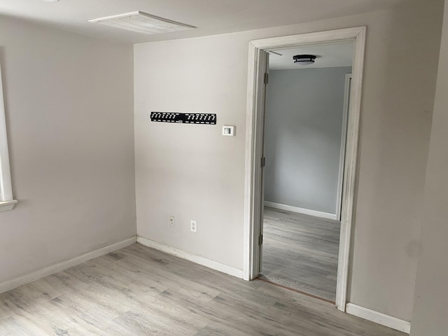 1095 Harding Dr, Grand Blanc, MI 48507 - unfurnished room featuring wood finished floors and baseboards