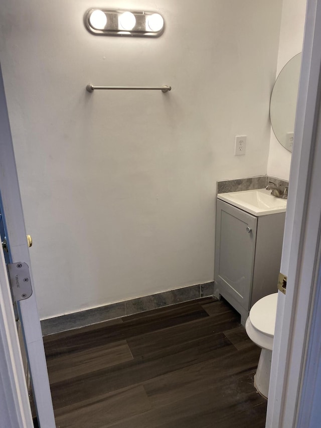 1095 Harding Dr, Grand Blanc, MI 48507 - half bathroom with vanity and wood finished floors