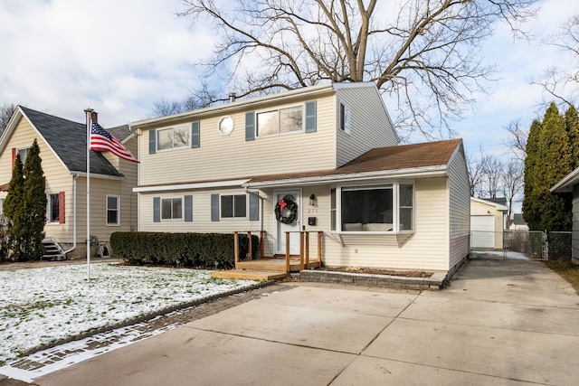 view of front of home with an outdoor structure and a garage