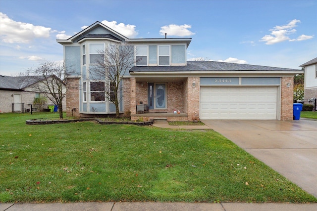 front of property with a front yard and a garage