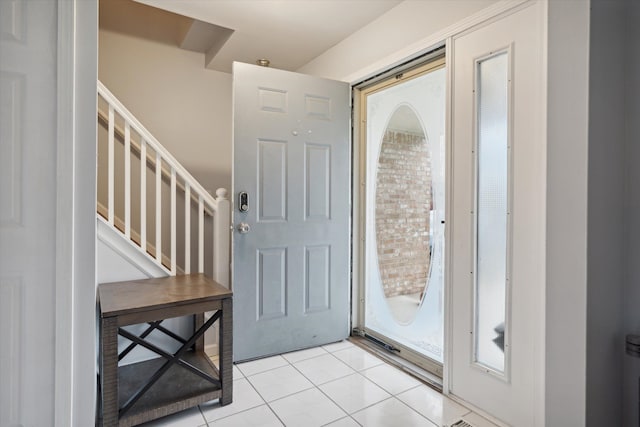 entryway featuring light tile patterned floors