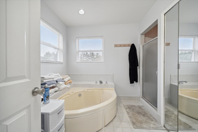 bathroom featuring tile patterned floors and shower with separate bathtub