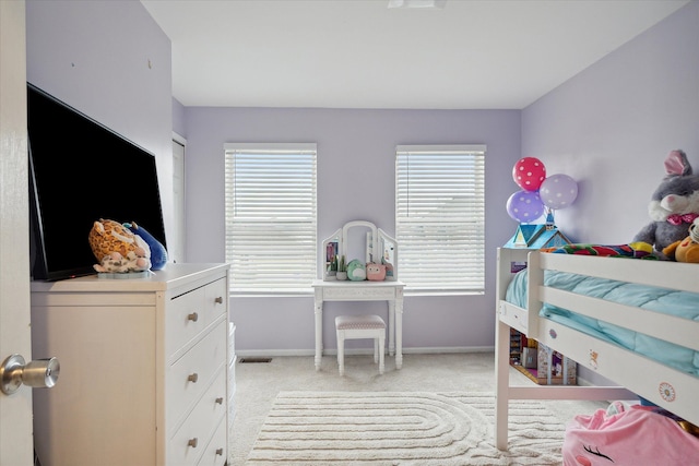 bedroom featuring multiple windows