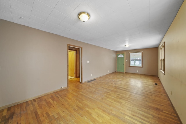 spare room with light hardwood / wood-style floors