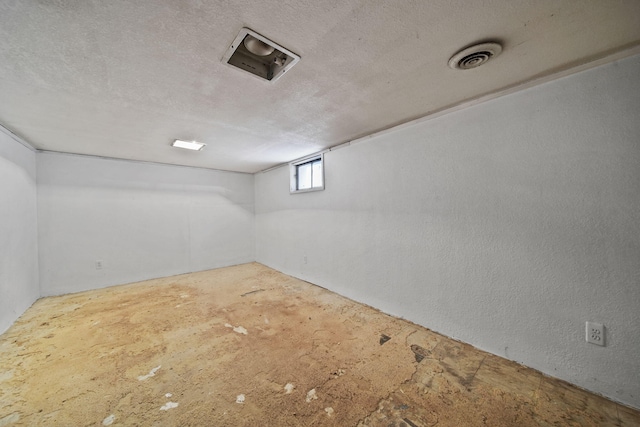 basement with a textured ceiling