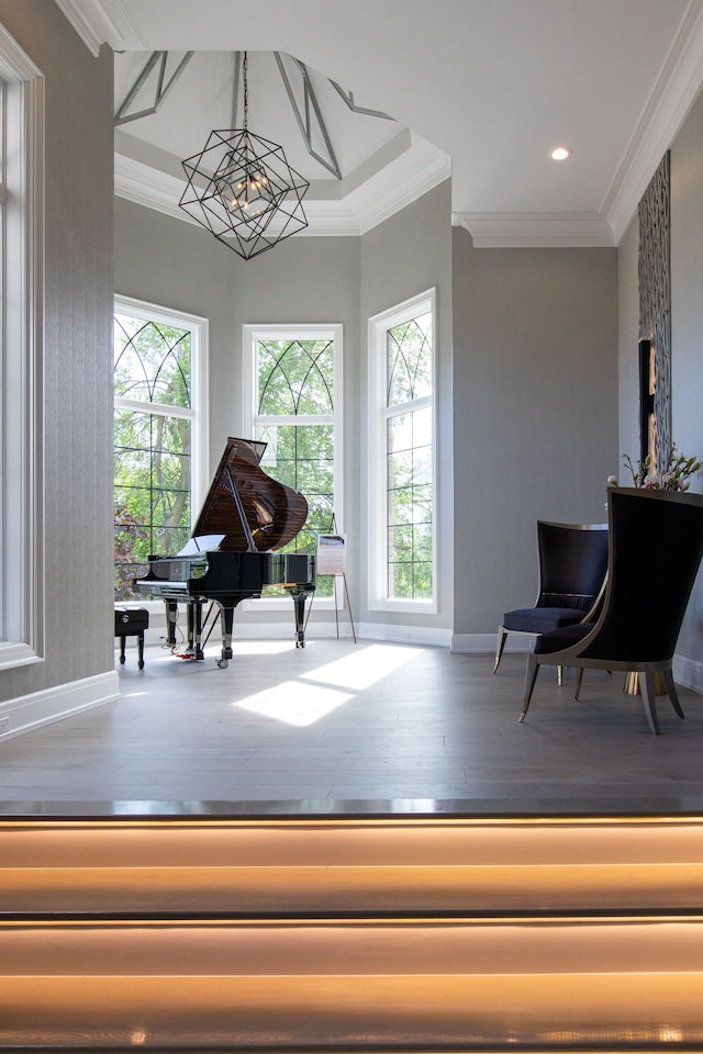 sitting room featuring hardwood / wood-style floors, plenty of natural light, and ornamental molding