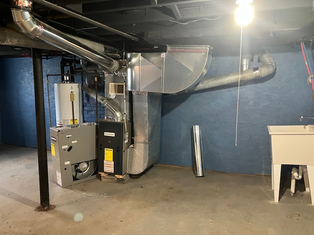 utility room featuring heating unit and water heater