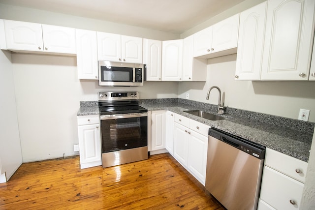 kitchen featuring white cabinetry, sink, and stainless steel appliances