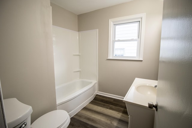 full bathroom featuring hardwood / wood-style flooring, vanity, toilet, and shower / bathing tub combination