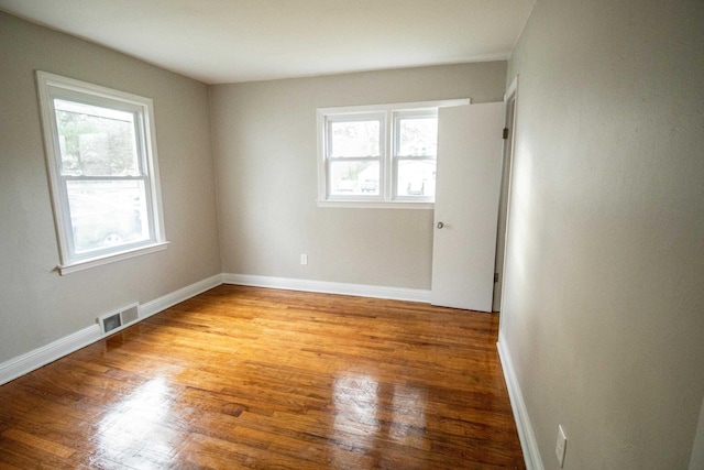 spare room with light hardwood / wood-style floors