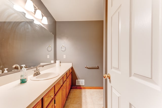 bathroom featuring tile patterned flooring and vanity