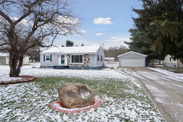 single story home with a garage and an outdoor structure