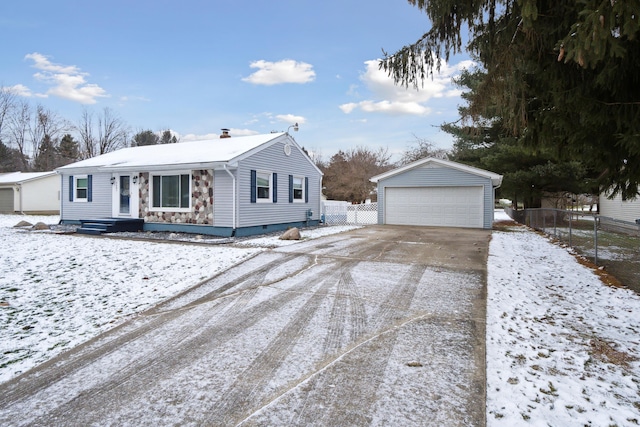 view of front of property featuring a garage and an outdoor structure