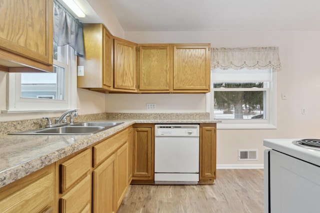 kitchen with range with electric stovetop, sink, dishwasher, and light wood-type flooring