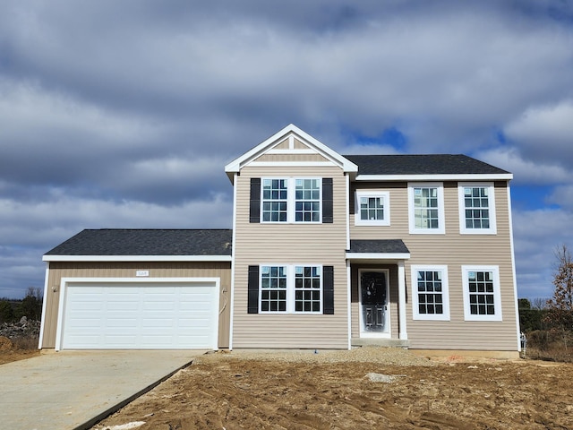 view of front facade featuring an attached garage, driveway, and roof with shingles