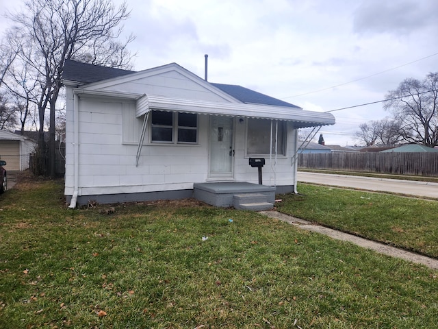 bungalow with a front yard