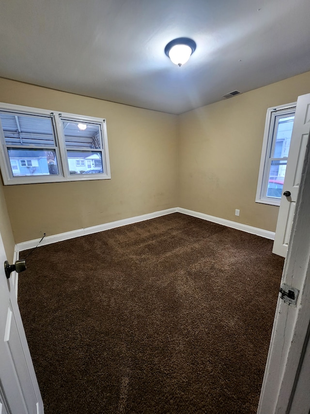 empty room featuring carpet flooring