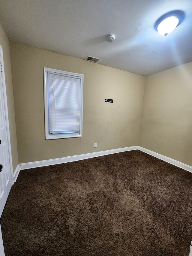 spare room featuring carpet flooring