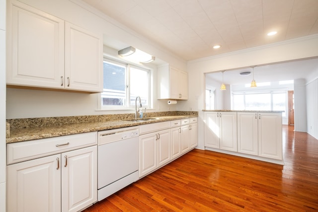 kitchen featuring dishwasher, decorative light fixtures, white cabinetry, sink, and kitchen peninsula