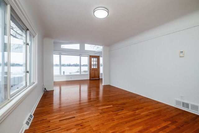 spare room with hardwood / wood-style floors