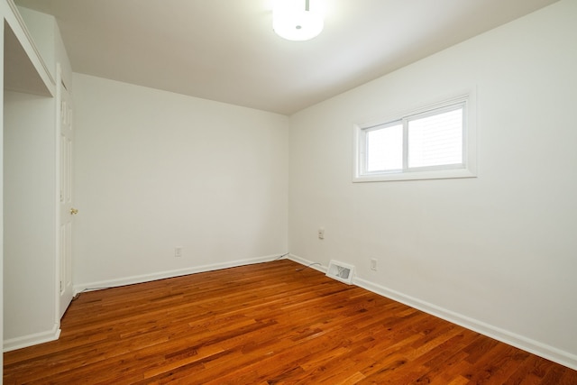 unfurnished room featuring wood-type flooring