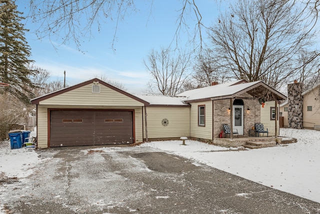 ranch-style home featuring a garage