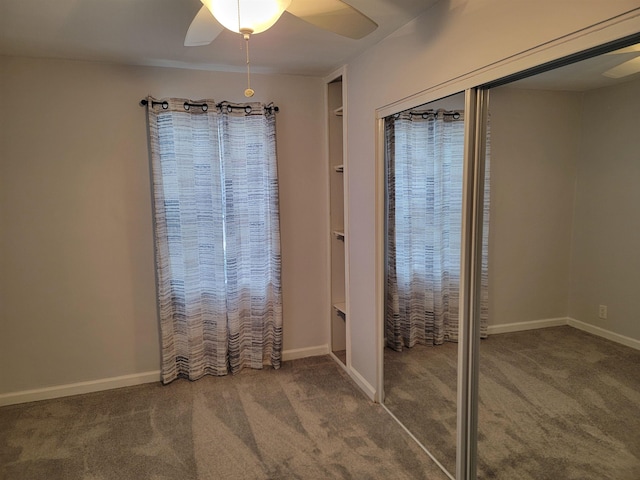 interior space with ceiling fan, a closet, and carpet